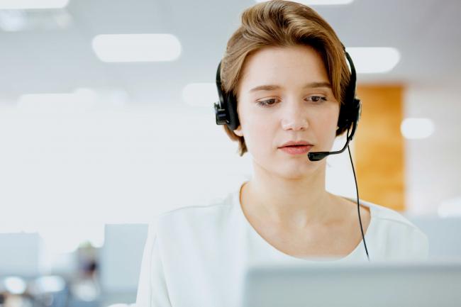 Woman working in support customer service Woman working in support customer service